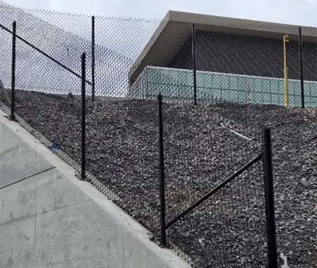 A fence that is on top of a hill.