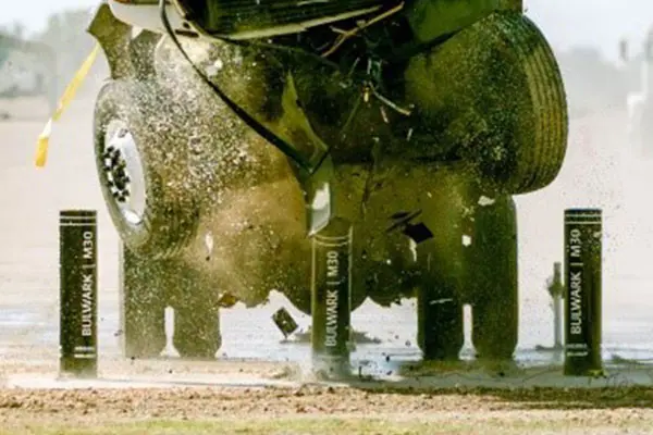 A horse is being hit by a water pump.