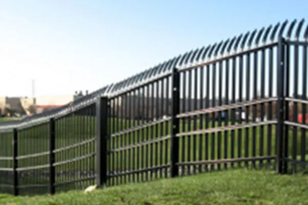 A fence that is made of metal and has a gate.